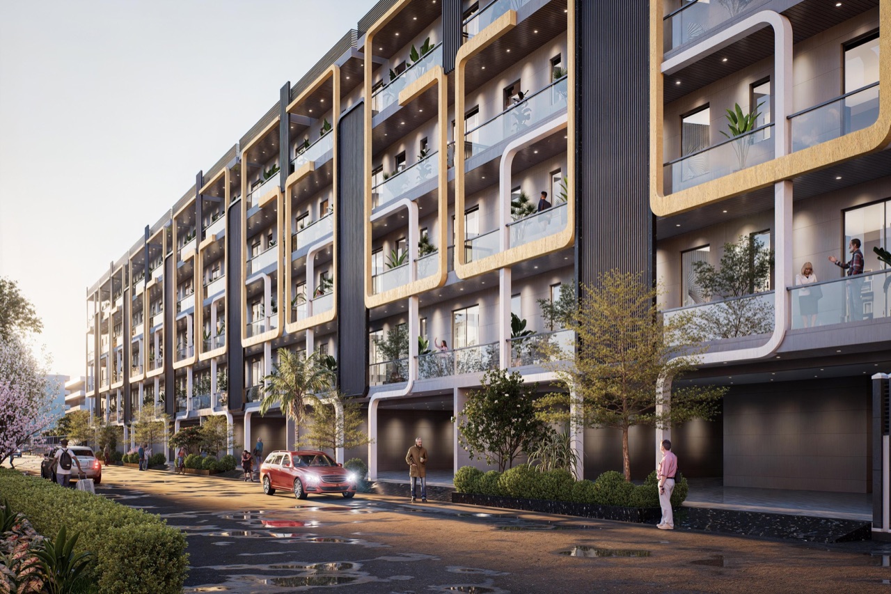 Niharika Buildwell Independent Floors at twilight — warmly lit four-storey premium homes with balcony greenery and curved white architectural accents at M3M City of Dreams, Panipat